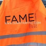 เสื้อกันฝนสีส้ม แบบชุดคลุม คาดแถบสะท้อนแสง สกรีนโลโก้ FAME FOOD ART MUSIC ENTERTAINMENT เสื้อกันฝนสีส้ม แบบชุดคลุม คาดแถบสะท้อนแสง สกรีนโลโก้ FAME FOOD ART MUSIC ENTERTAINMENT